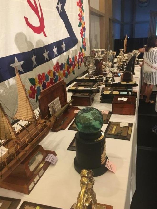 Tables full of trophies - just a portion of the dozens of perpetual awards in the TPYC collection - 2017 Transpac © Dobbs Davis